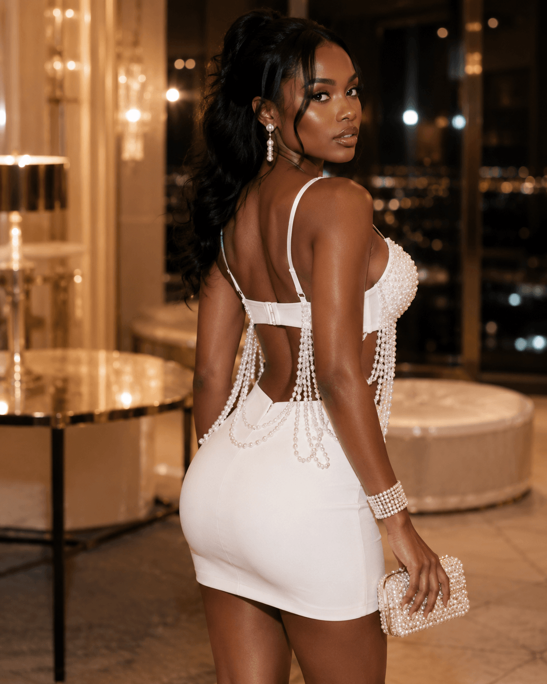Model wearing a Pearl-Effect Beaded Fringe Bustier Crop Top, showcasing its elegant design and beaded details.