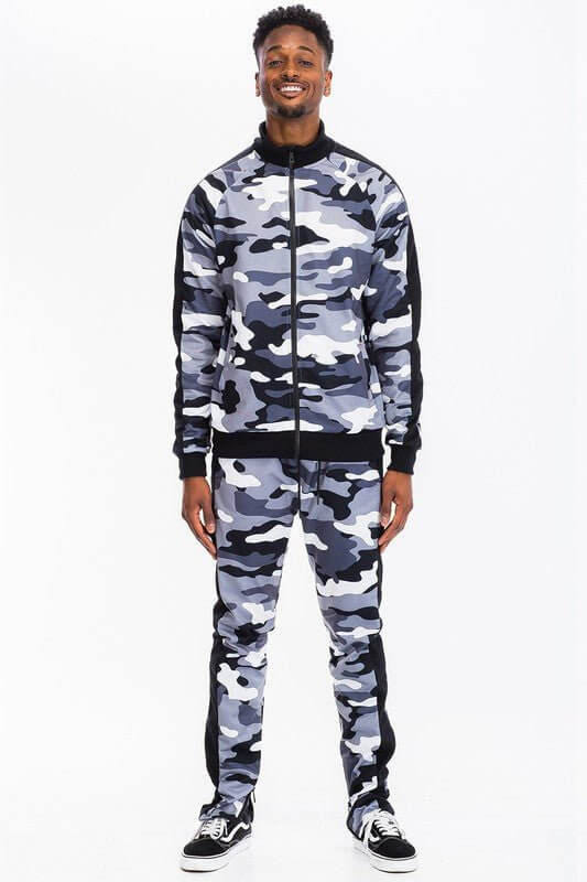 A man wearing a grey camo tracksuit showcasing urban style in the ultimate streetwear fashion guide.