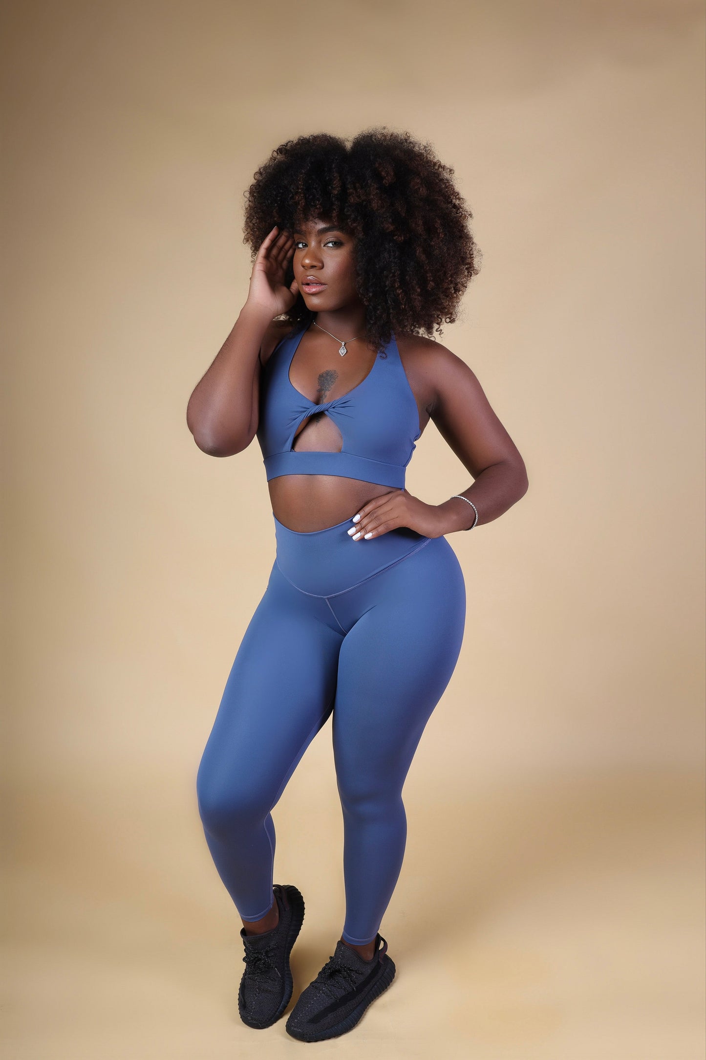 Women’s Cutout Infinity Sports Bra worn with matching leggings, showcasing stylish cutout and seamless design.