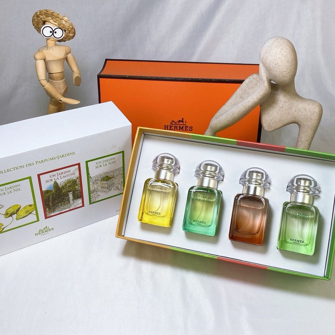 Luxury mini perfume gift sets featuring Hermès fragrances in elegantly packaged box.