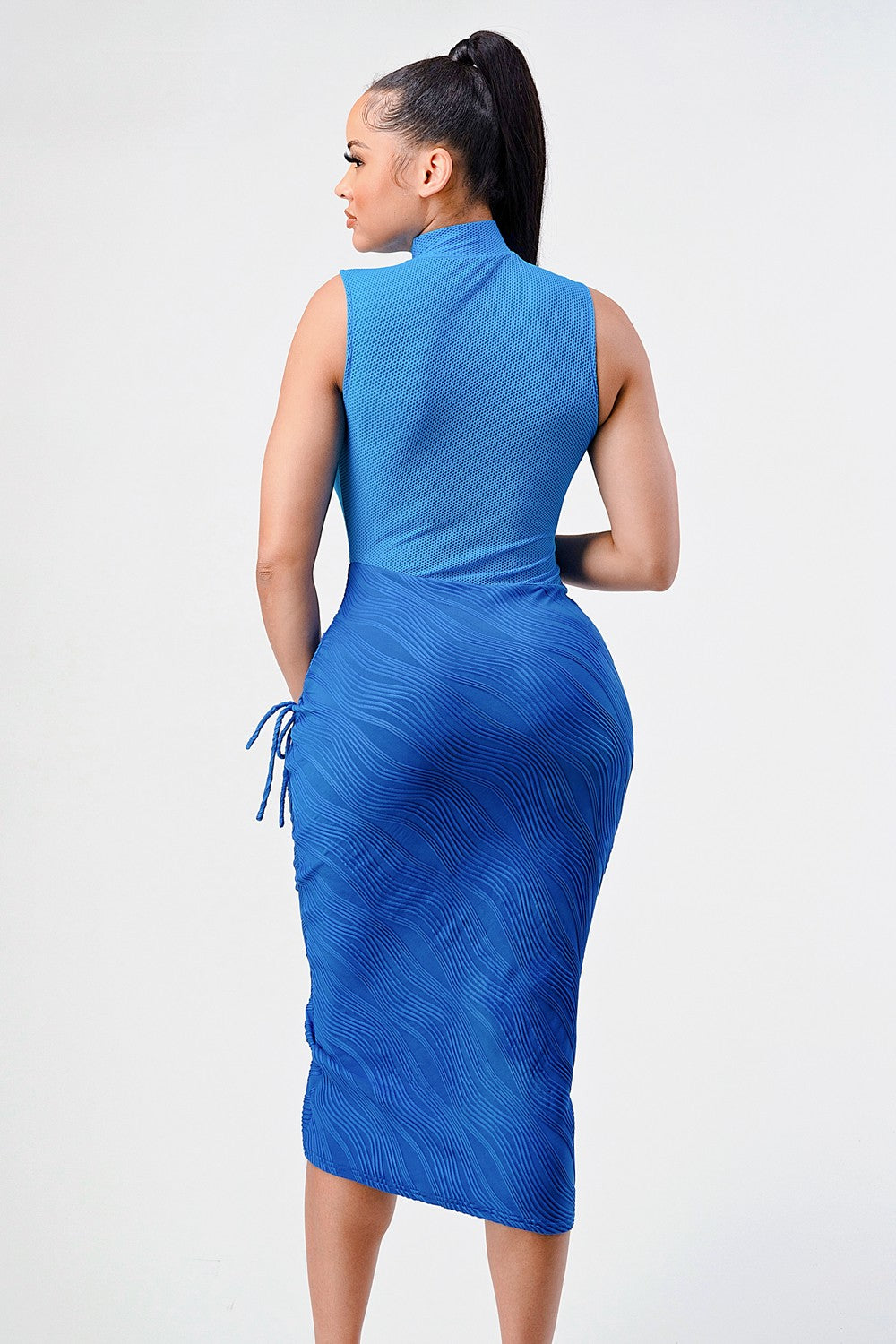 Ocean blue sleeveless midi dress featuring textured fabric and high neckline on a model.