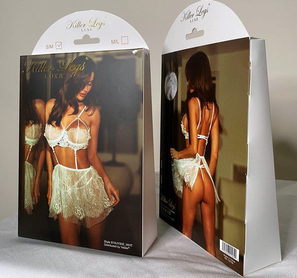 Clocking Out Faux Leather Bodysuit packaging box, front and back view displayed on table
