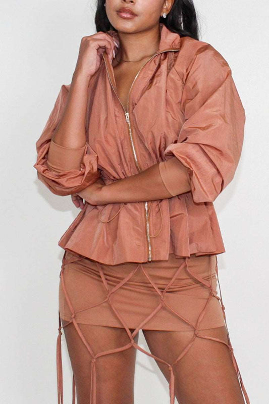 Desert rose windbreaker skirt set in soft brown, showcasing a cinched waist windbreaker paired with a stylish tassel skirt.