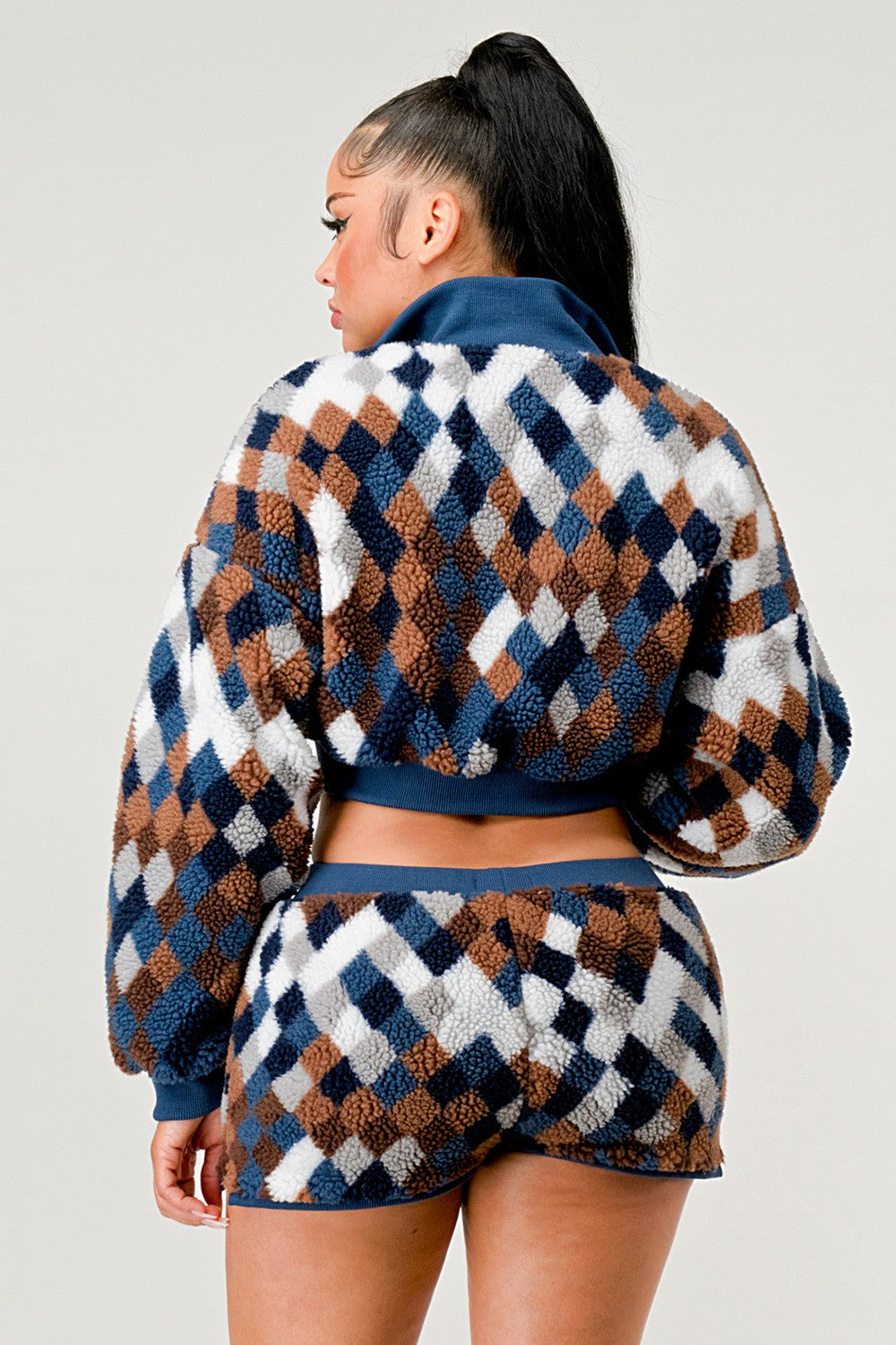 Checker print two piece set featuring a cozy long-sleeve top and matching shorts in trendy colors.