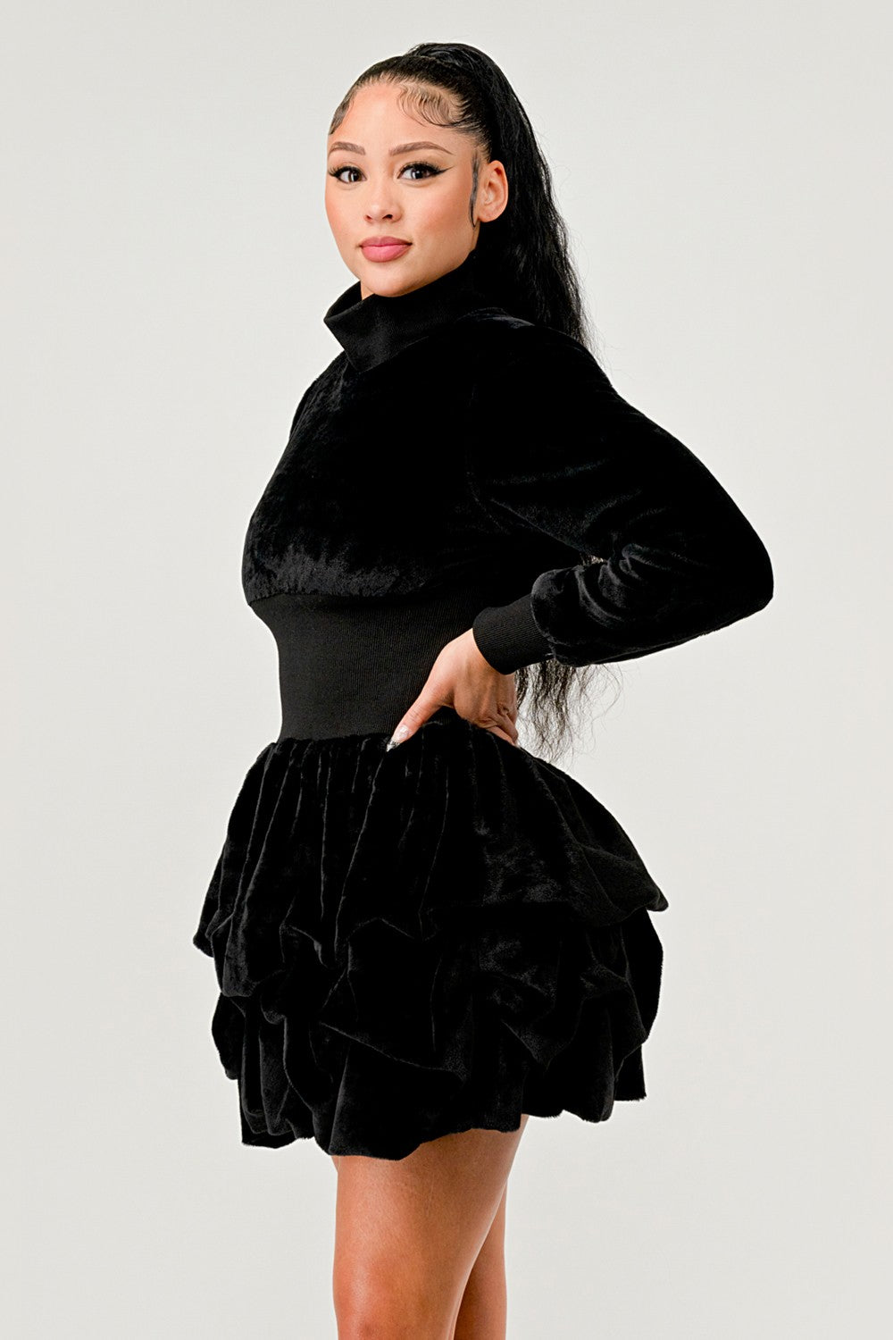 Merry Go Around Ruffle long sleeve dress showcased on a model featuring a sophisticated ruffled hem and elegant design.