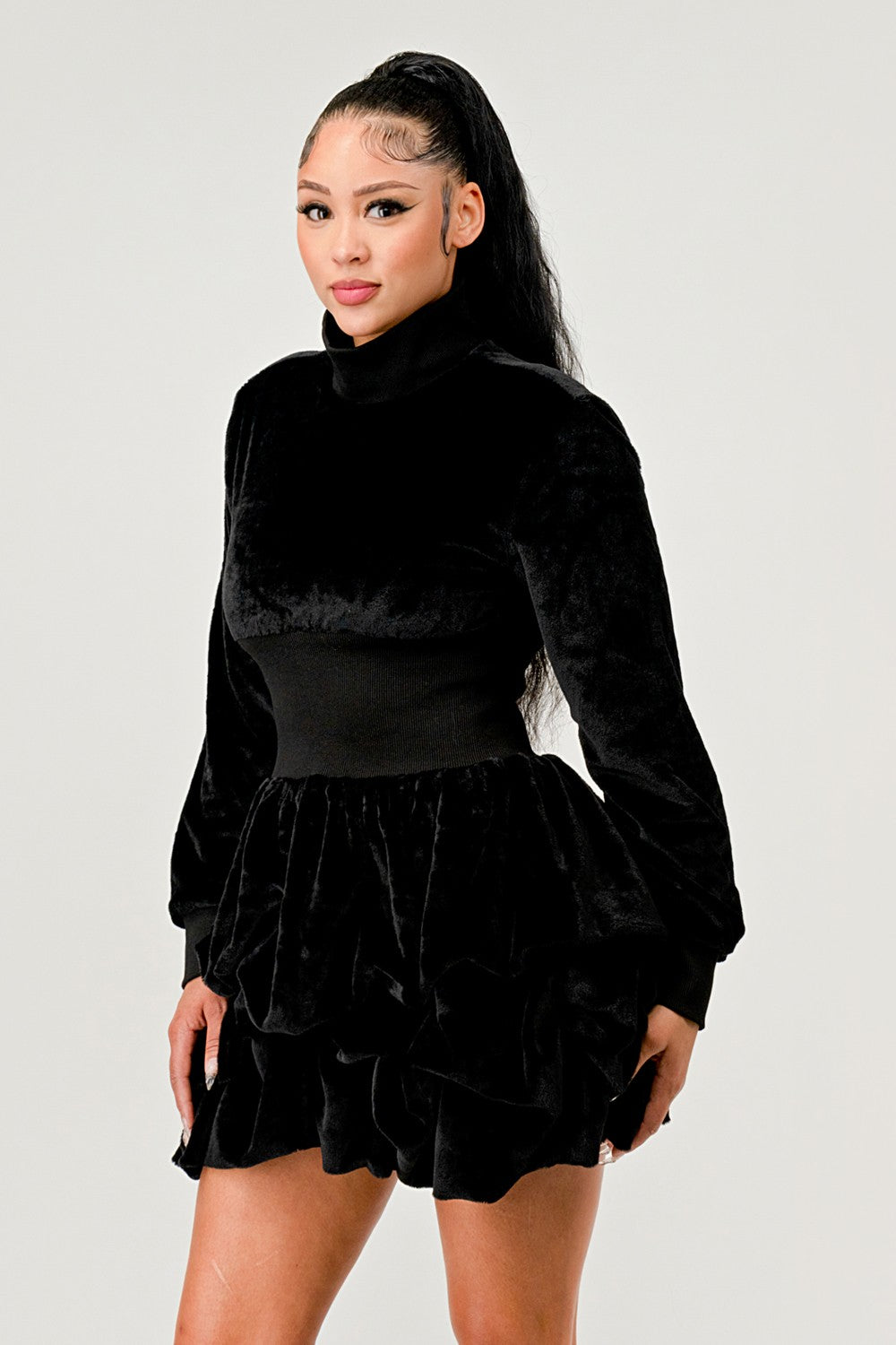 Merry Go Around Ruffle long sleeve dress in black, showcasing playful ruffles and elegant design.
