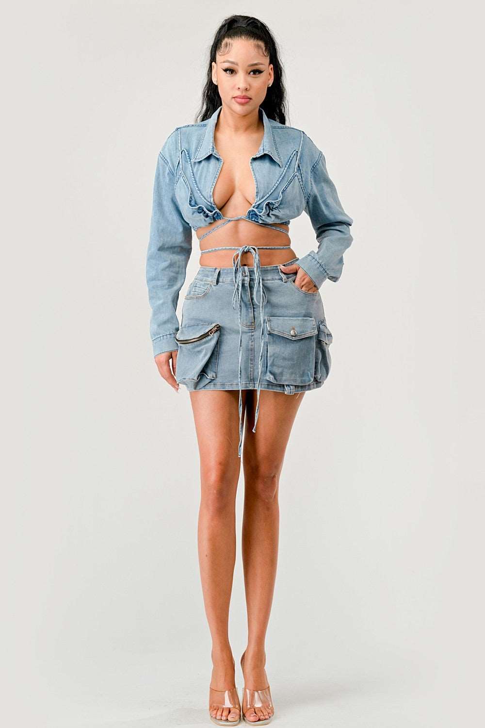 Cropped denim jacket with tie-front paired with matching skirt in a stylish outfit.