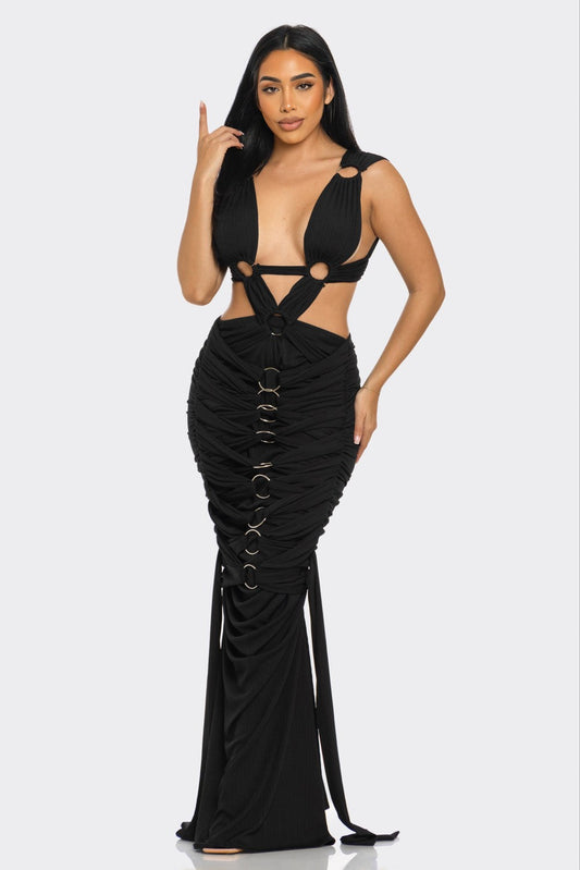 Elegant pleated gown for special occasions featuring a plunging neckline and unique circular accents.