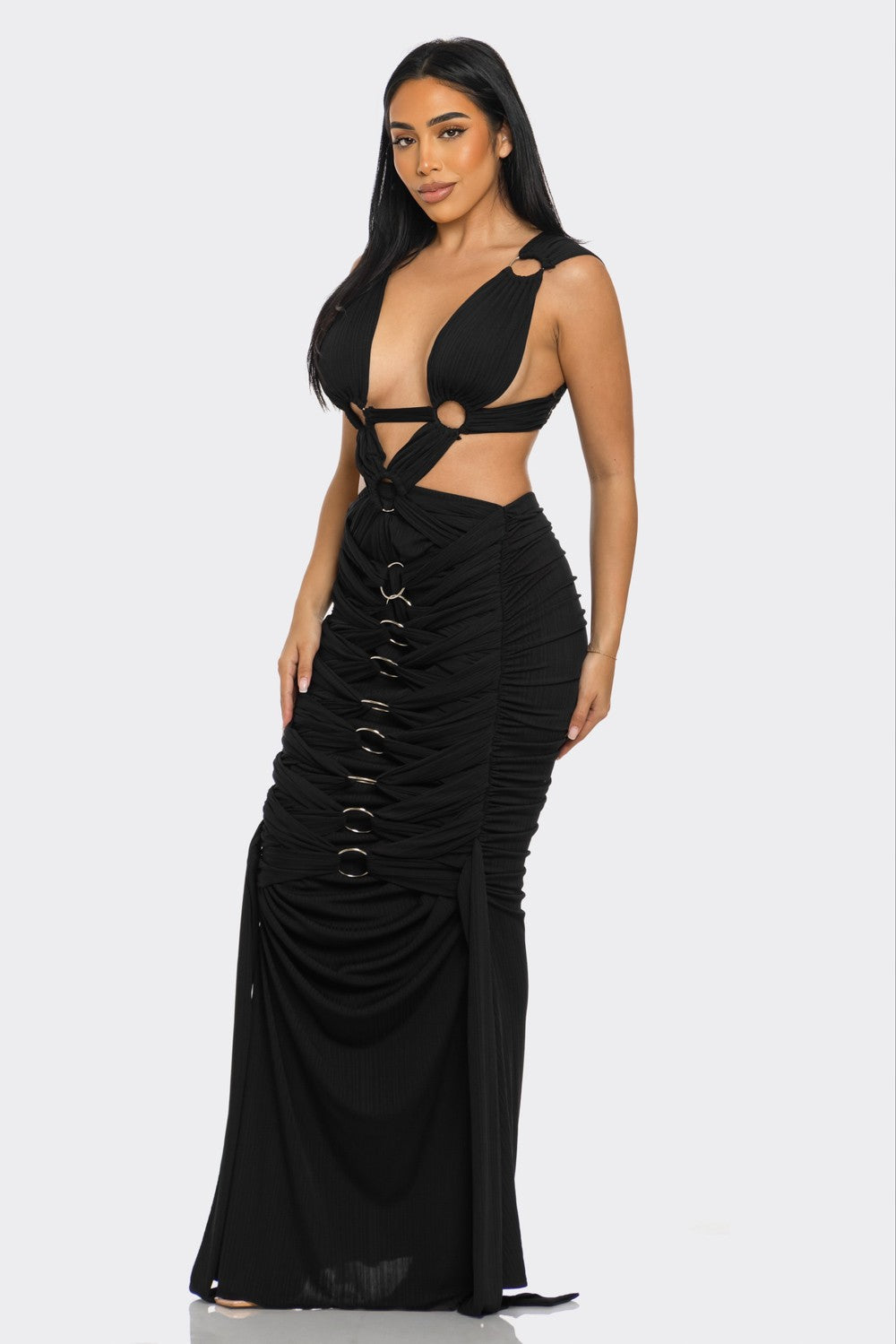 Elegant pleated gown for special occasions featuring unique bodice design and circular accents.