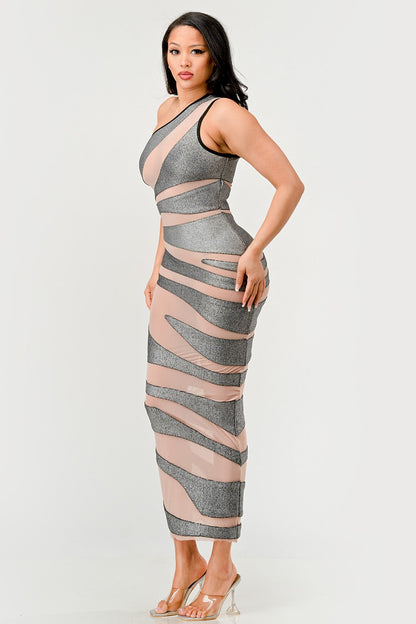 Model in a metallic bandage mesh dress with asymmetrical neckline and striking design.