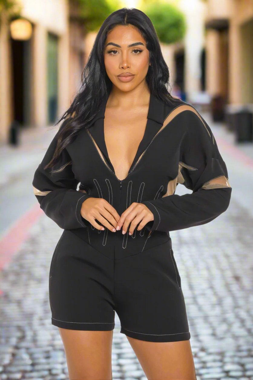 Chic mesh panelled black romper featuring a zip front and stylish design, perfect for day or night events.