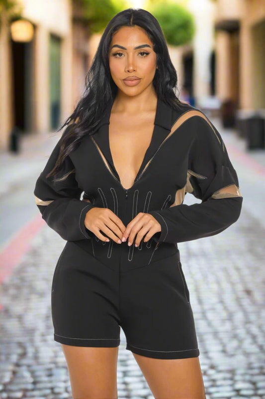 Chic mesh panelled black romper featuring a zip front and stylish design, perfect for day or night events.