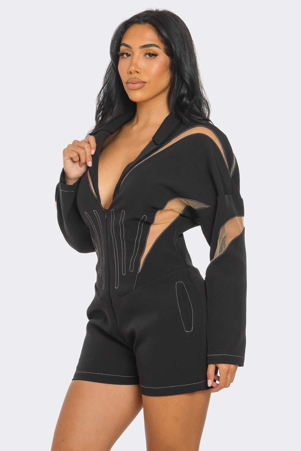 Chic mesh panelled black romper featuring stylish mesh details and a modern silhouette, perfect for any stylish occasion.