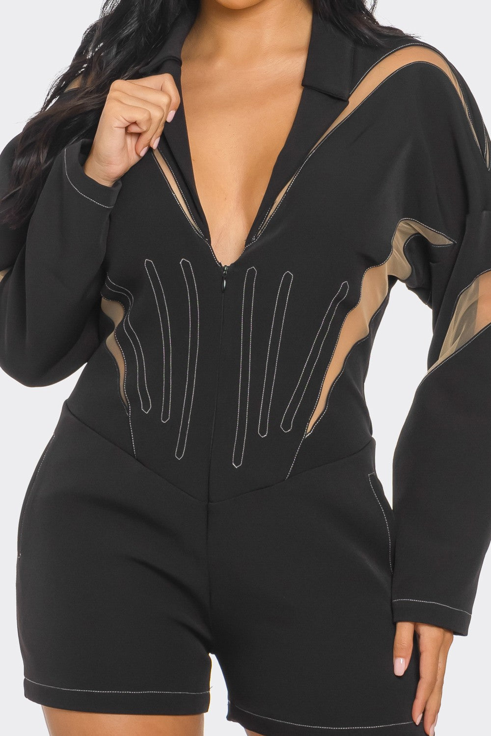 Chic mesh panelled black romper featuring stylish mesh panels and a zip front.