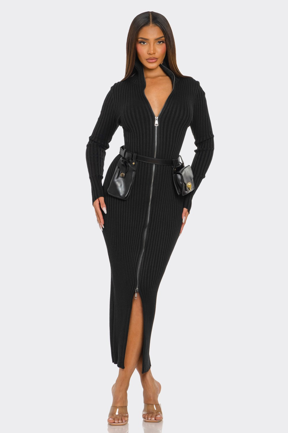 Model wearing a ribbed knit utility dress with front zipper and removable utility belt, showcasing modern style.