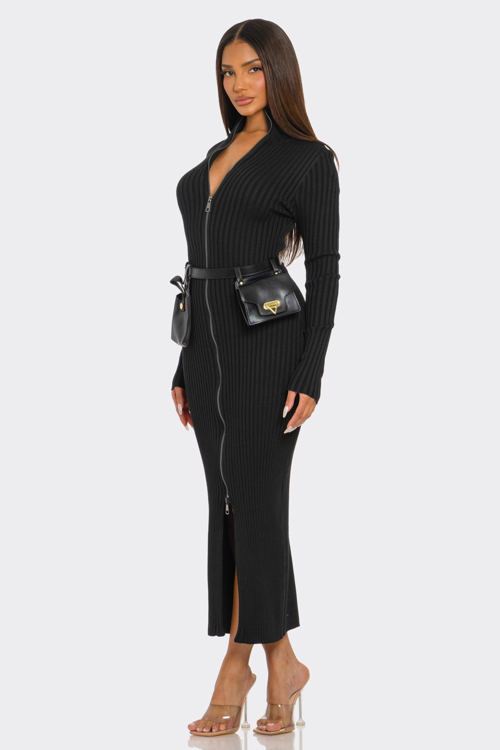Model wearing a ribbed knit utility dress with a zipper and utility belt featuring mini pouches.