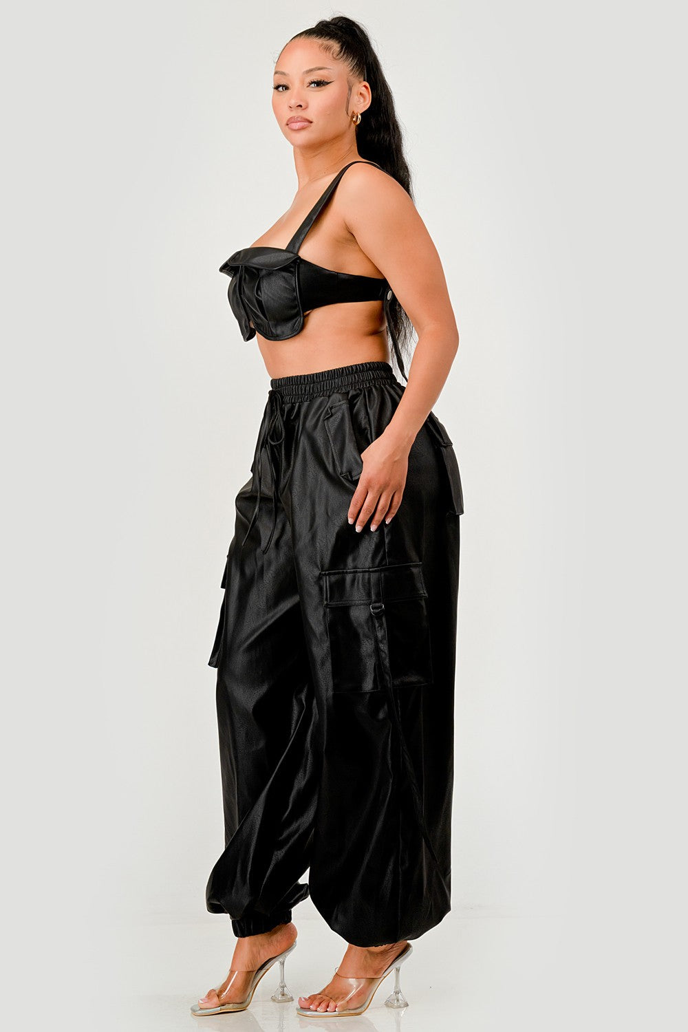 black utility crop top cargo pants set on model, showcasing utility-style flap accents and relaxed cargo design