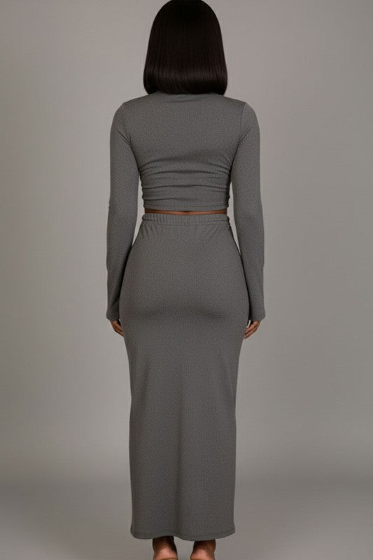Mock neck crop top and maxi skirt set in gray, showcasing the back view of the sophisticated outfit.