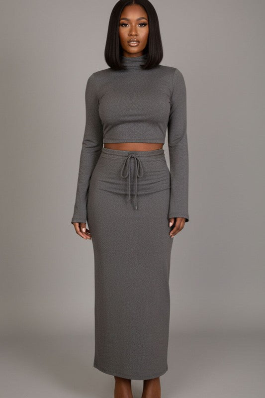Mock neck crop top and maxi skirt set featuring a chic bell sleeve design in gray, ideal for stylish occasions.