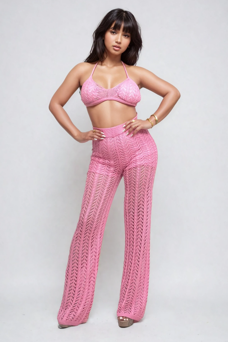 Pink crochet halter top and wide-leg pants set by ATHINA RETAIL, showcasing stylish summer fashion with intricate knit details.