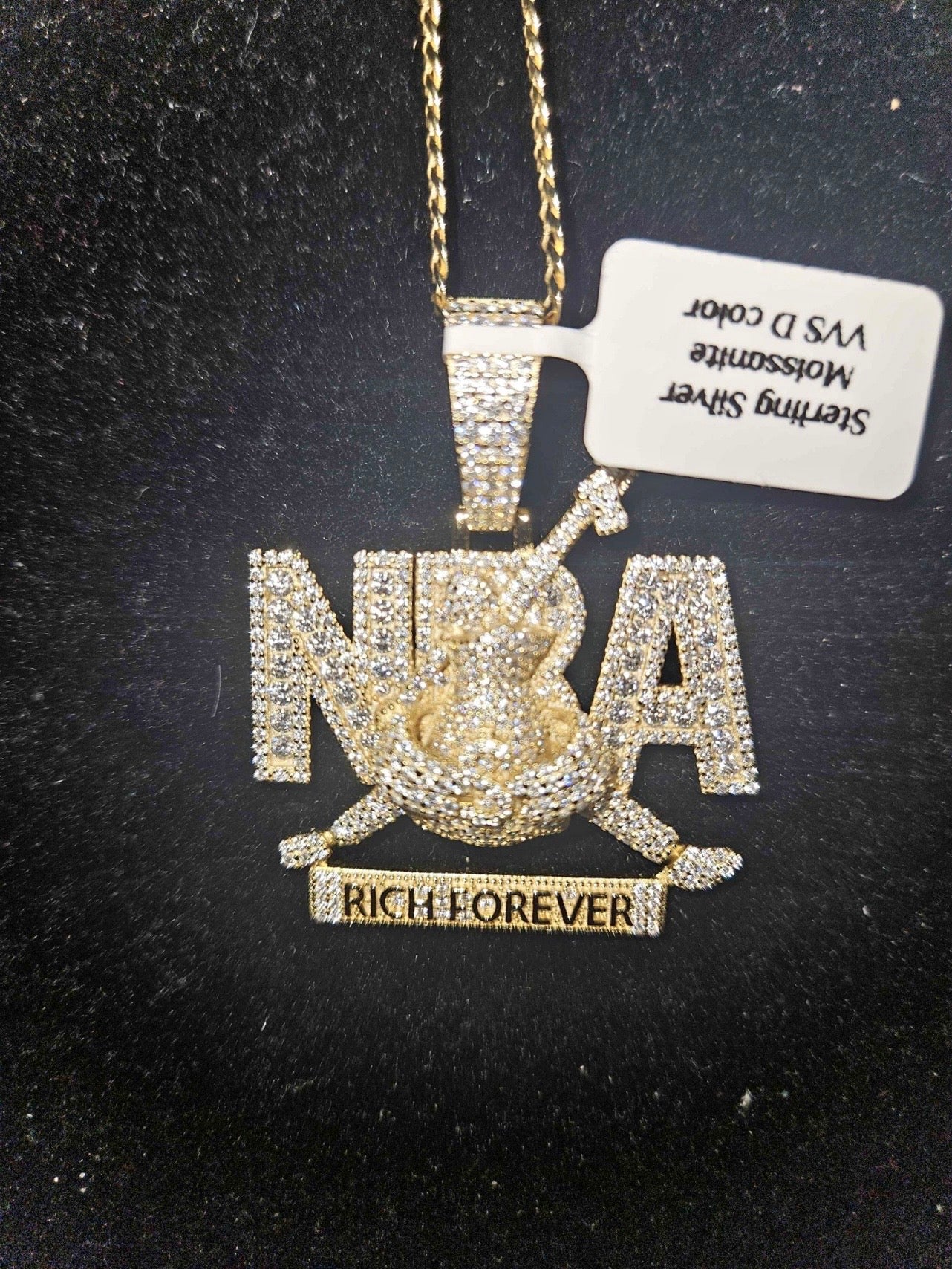 NBA moissanite pendant chain featuring luxurious iced-out design with sparkling stones and distinctive lettering.