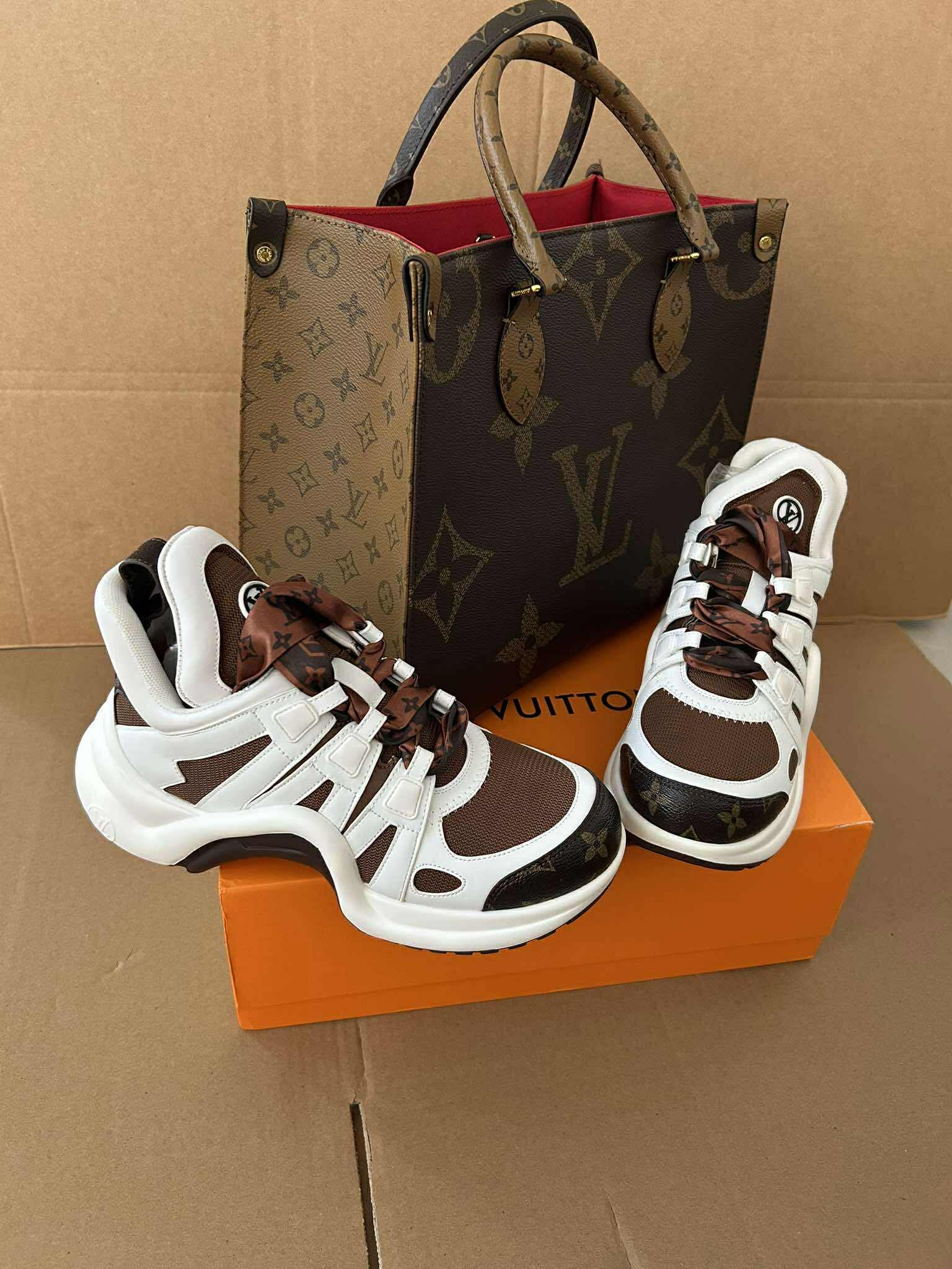 Luxury monogram sneaker set featuring stylish athletic sneakers and a matching tote bag.