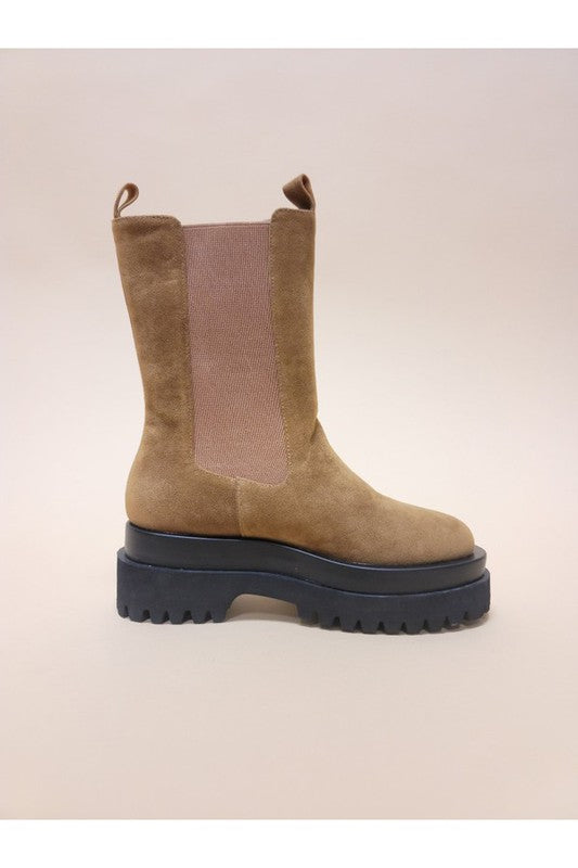 Slip-on platform combat boots featuring a suede design, side elastic panels, and a chunky platform sole.
