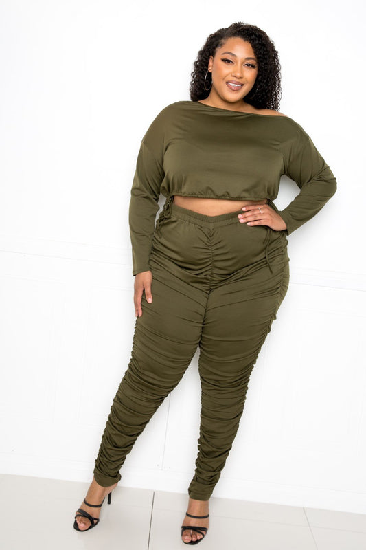plus size off shoulder cropped top set in olive green with ruched leggings, perfect for stylish comfort.