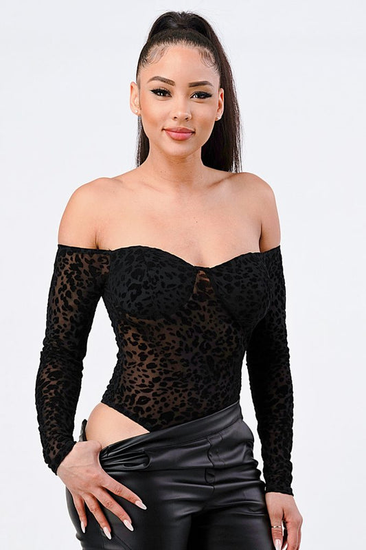 Leopard Print Off Shoulder Bodysuit featuring soft fabric and stylish design, worn by model showcasing fierce fashion.