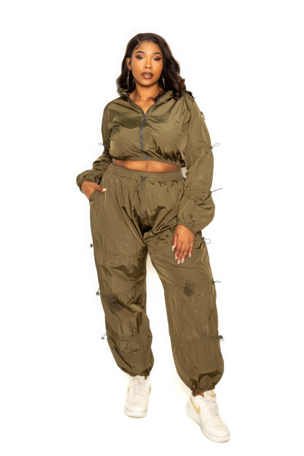 Active zip up workout set in olive green featuring cord lock detail and a flattering fit for all body types.