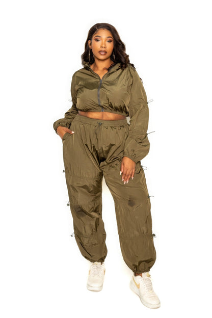 Active zip up workout set in olive green featuring cord lock detail and a flattering fit for all body types.