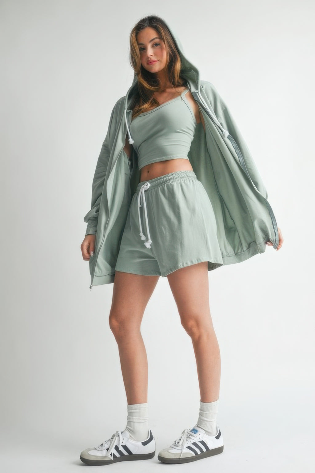 Woman modeling a rose cotton sweater set with a relaxed fit, perfect for casual outings and lounging.