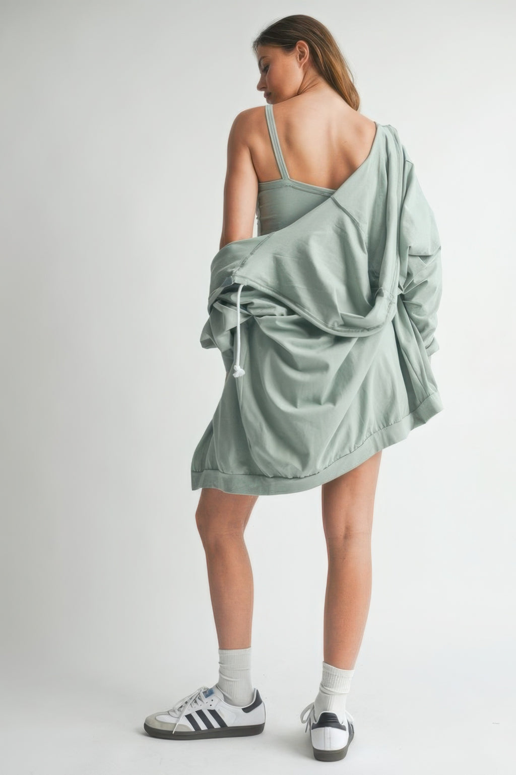 Model wearing a comfy green rose cotton sweater set, showcasing the stylish three-piece design from the back.