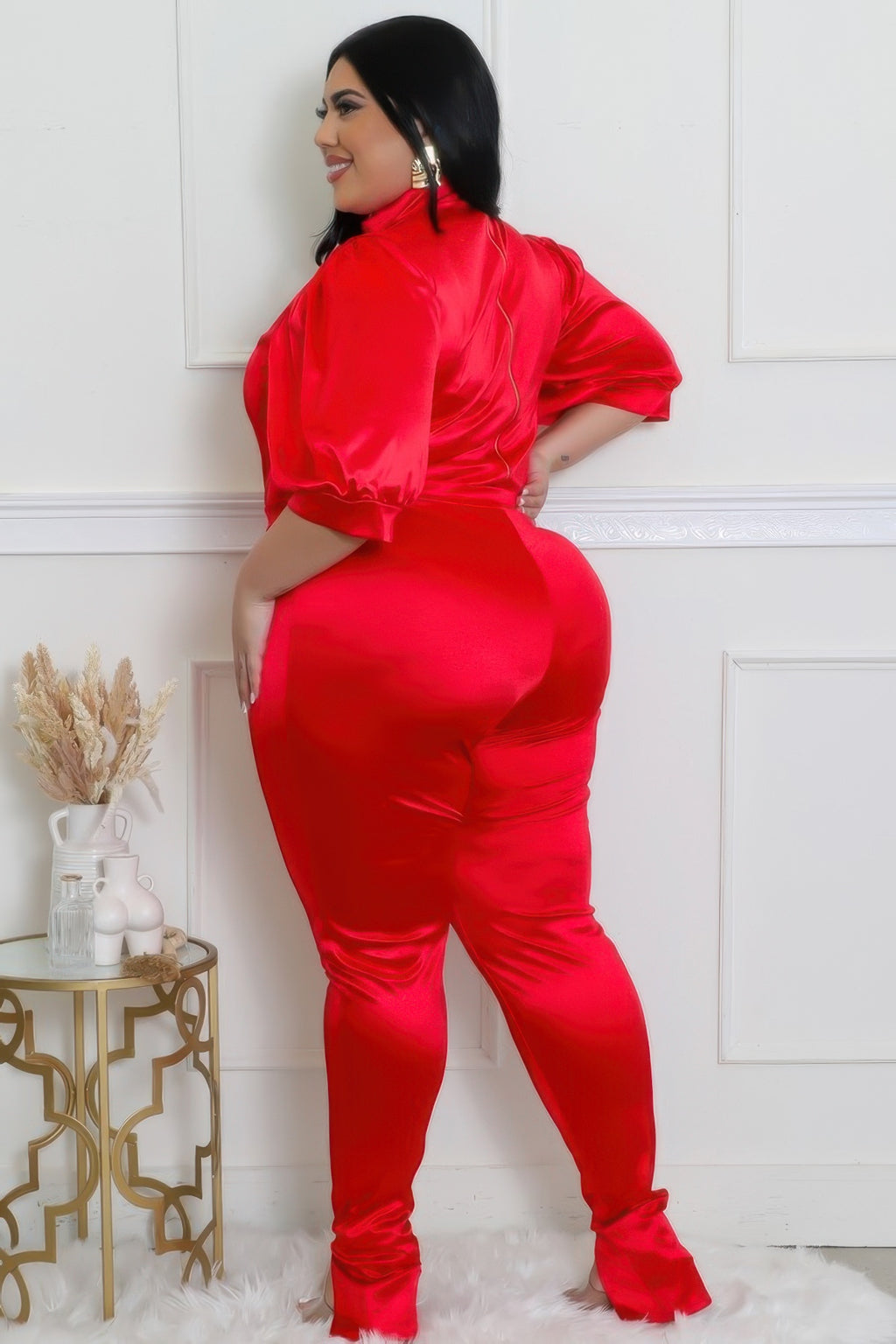 Stylish model showcasing a bodysuit pants set in red with a satin finish, emphasizing comfort and elegance.
