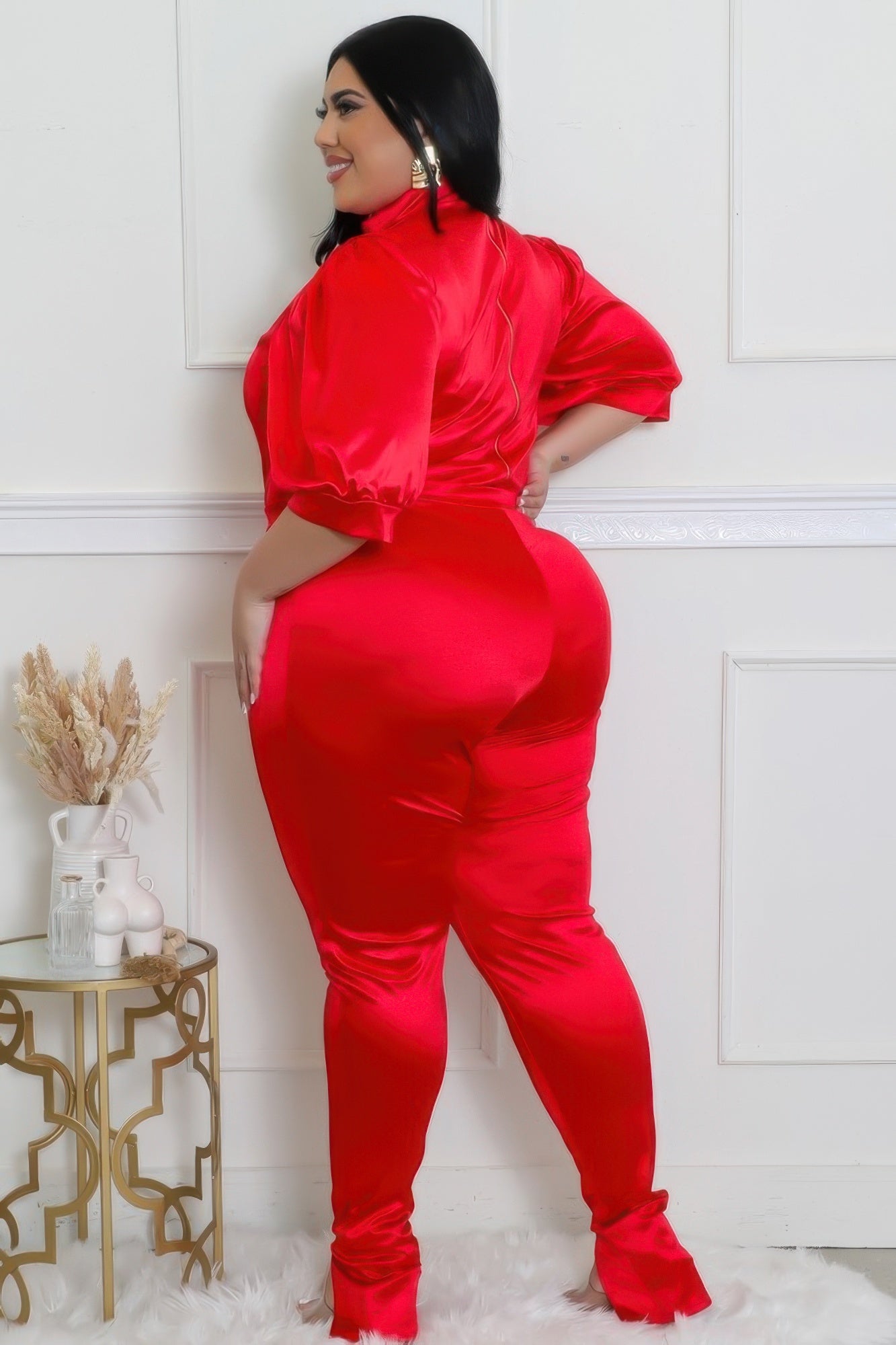 Stylish model showcasing a bodysuit pants set in red with a satin finish, emphasizing comfort and elegance.