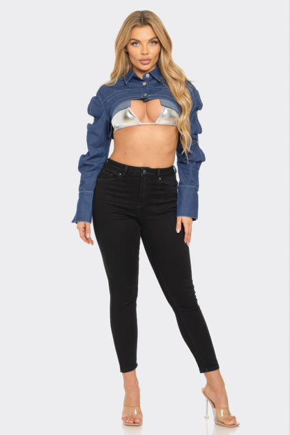 Model wearing a Button Down Denim Bolero jacket over a silver top, paired with black skinny jeans.