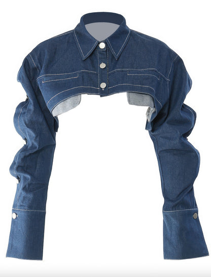 Button Down Denim Bolero, a stylish denim bolero jacket featuring a sharp collar and buttoned cuffs.