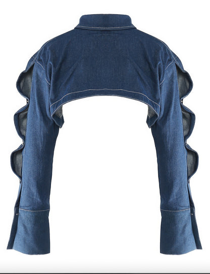 Alt Tag: Button Down Denim Bolero back view cropped long sleeve stretch denim jacket with collar, button cuffs, and ruffle sleeve detail