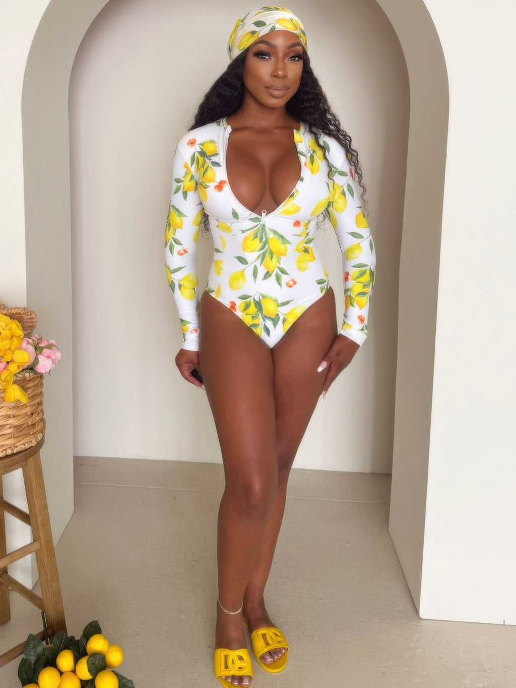 Alt Tag: Sorrento Citrus Zip One-piece citrus print long-sleeve swimsuit with front zip, worn with matching headscarf