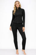Athletic zip up jacket and pant set in black, showcasing a fitted design and stylish comfort for workouts.