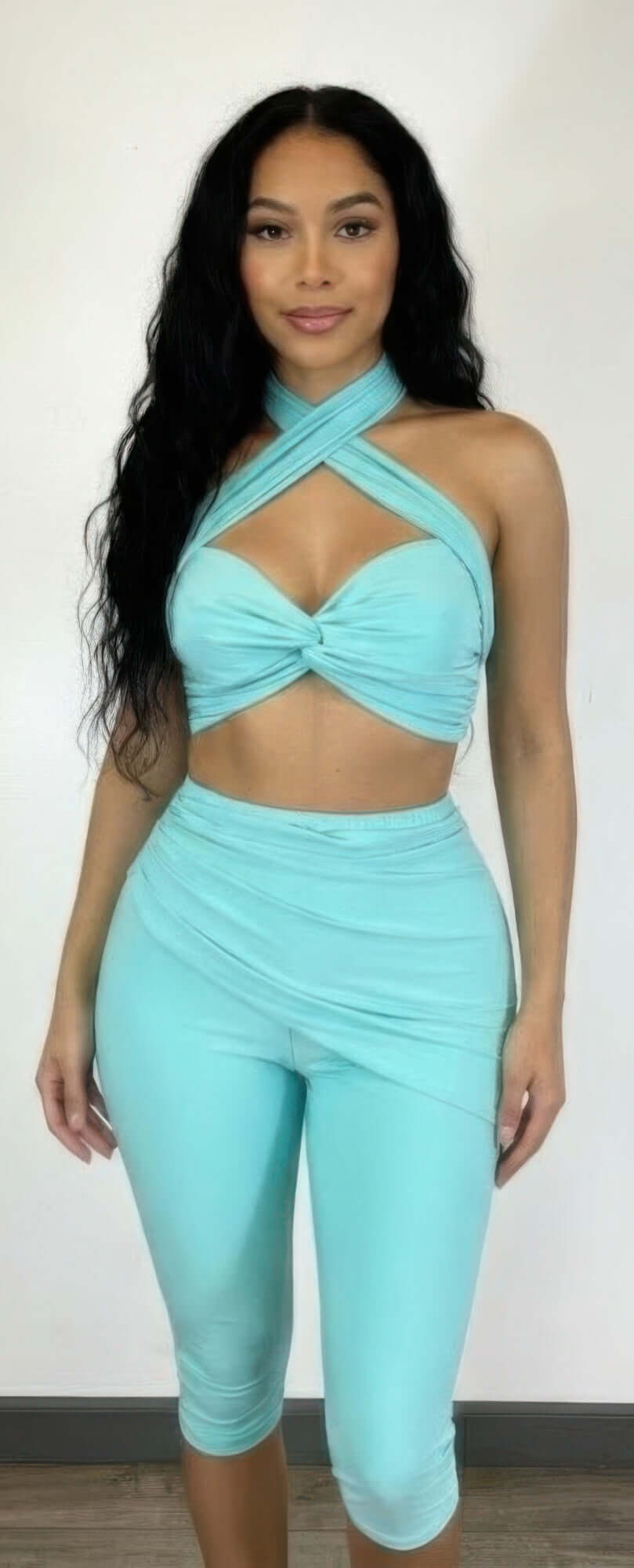 Alt Tag: Crisscross Halter Two Piece Set in aqua with twist-knot front, crisscross neckline and fitted high-waist bottoms on model