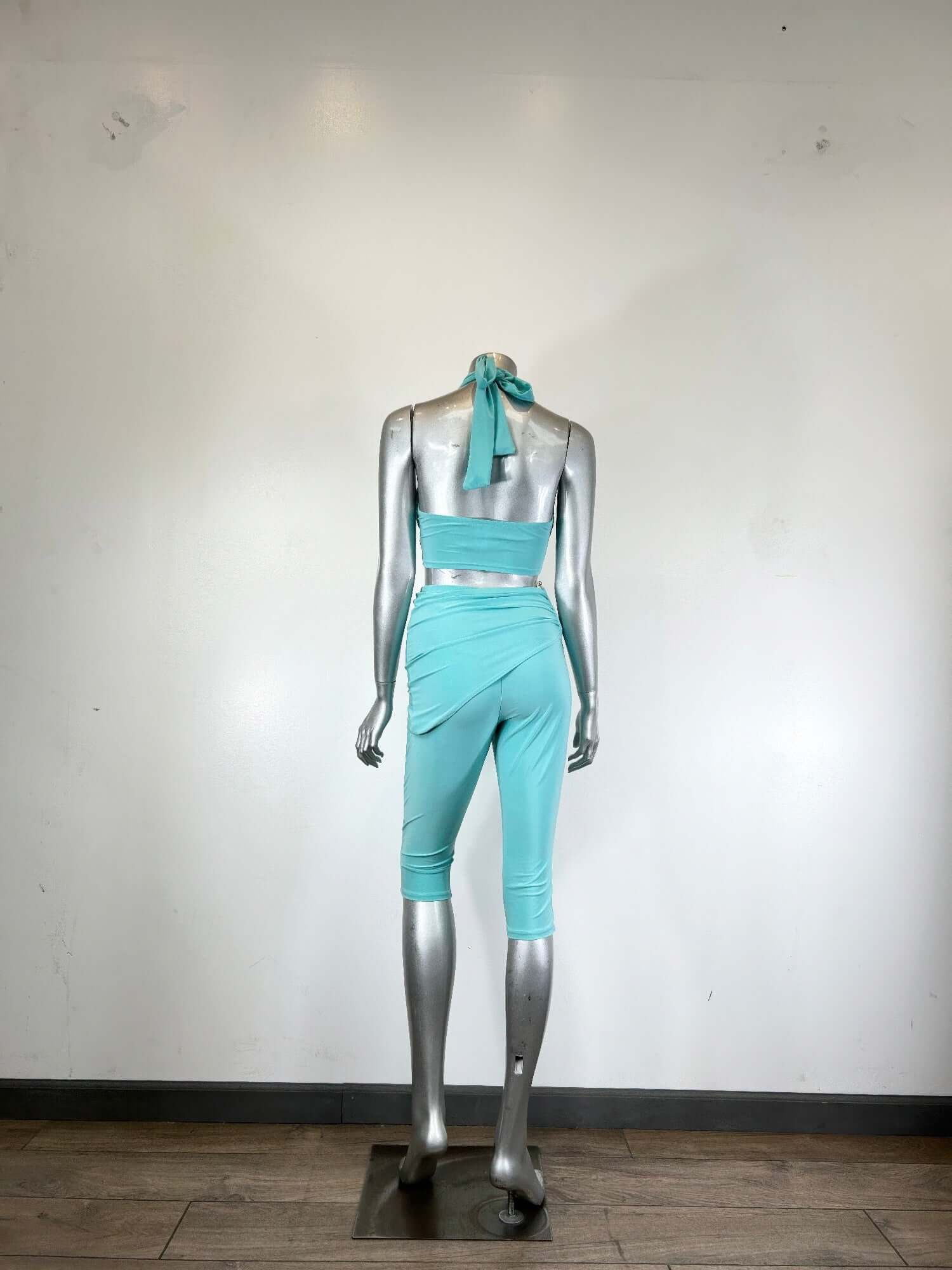 Alt Tag: Crisscross Halter Two Piece Set in aqua with twist-front halter top and fitted capri pants, displayed on mannequin