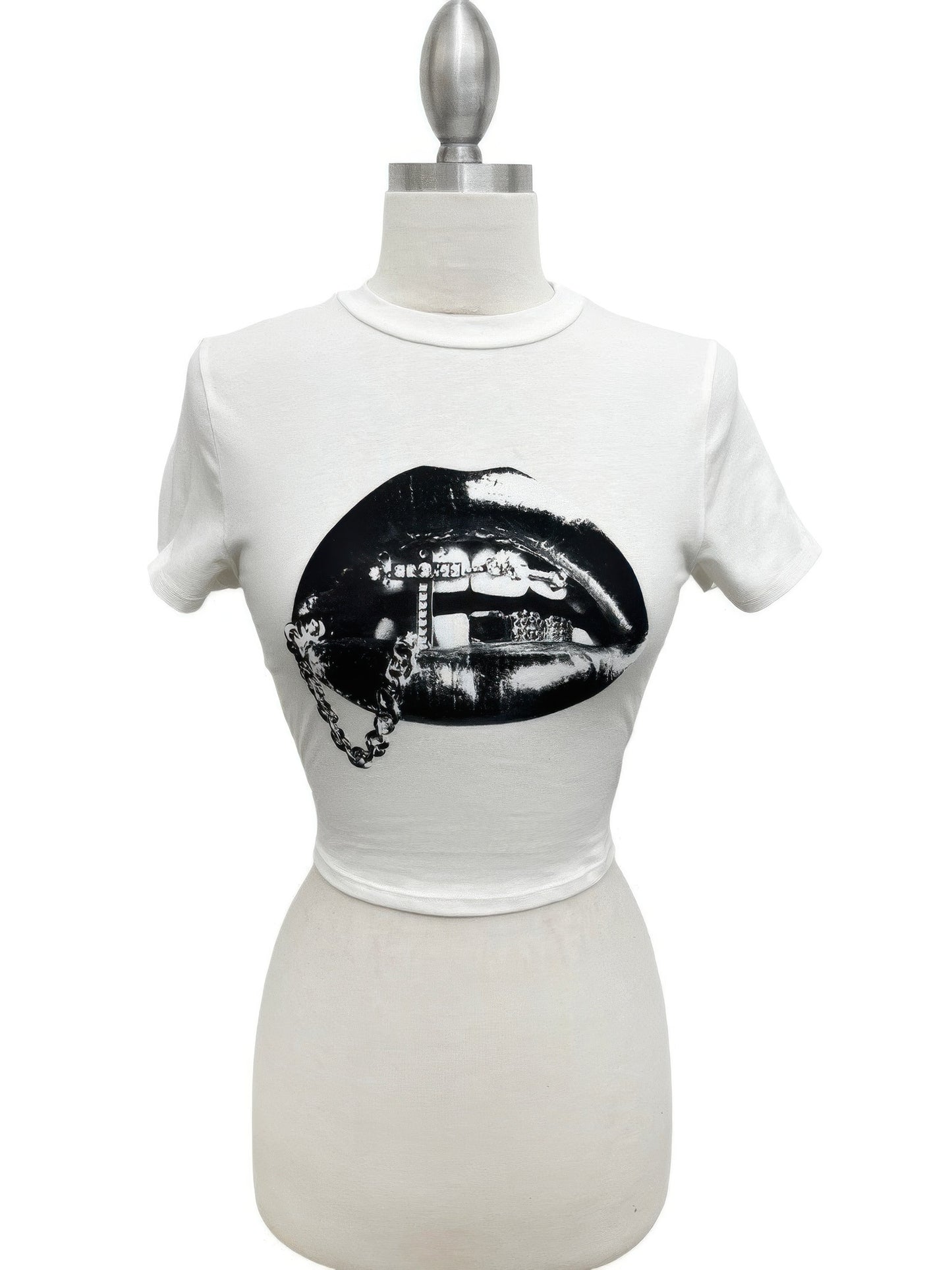 Alt Tag: Graphic Lips Crop Top white cropped tee with black lips screen-print graphic, short sleeves and round neckline on mannequin