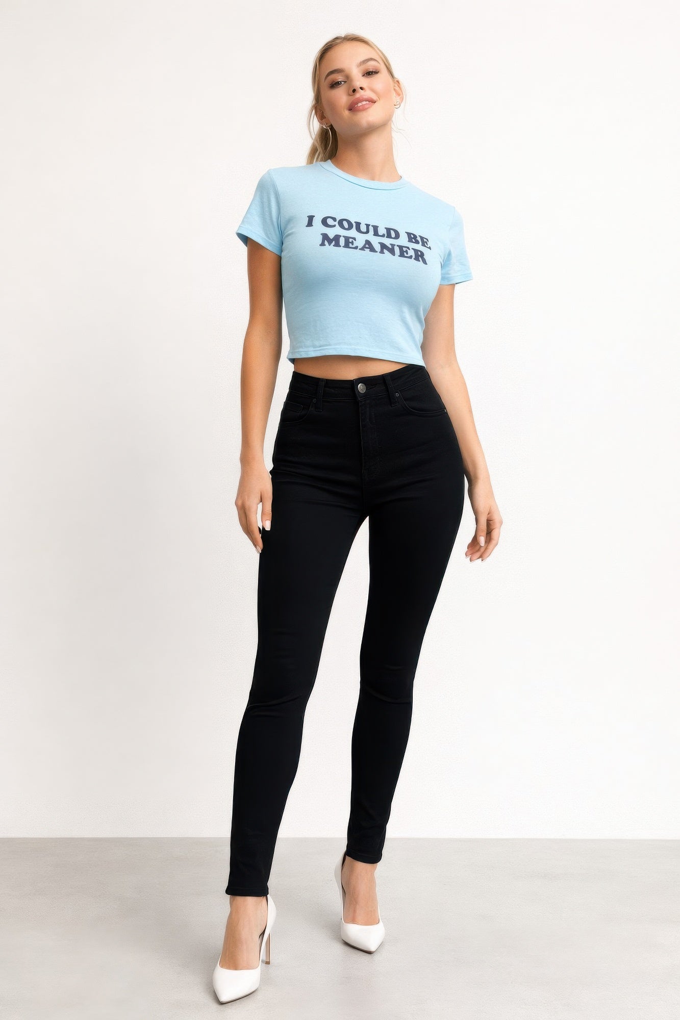 Alt Tag: I Could Be Meaner Graphic Crop Tee light blue screen-printed slogan crop top on model, round neck, short sleeves