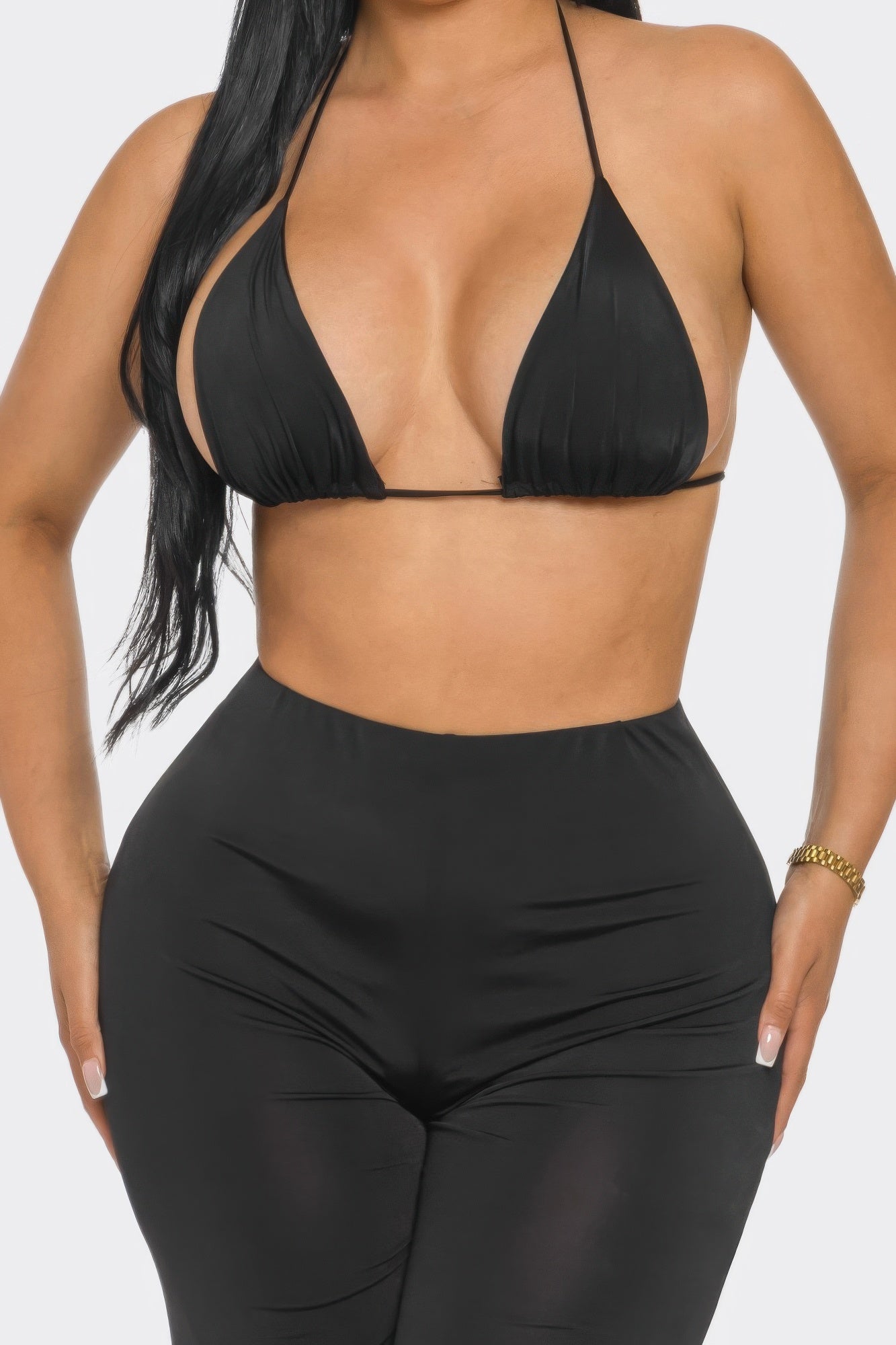 Three piece day to day outfit featuring a black bra top and high-waisted pants for a stylish look.