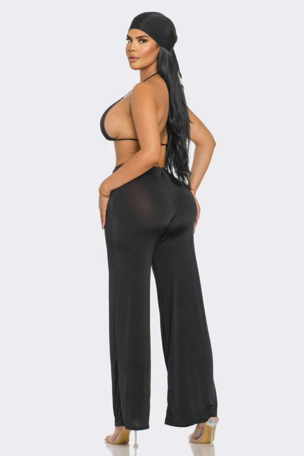 Model showcasing a Three Piece Day to Day Set including a bra top, wide-leg pants, and matching bandana.