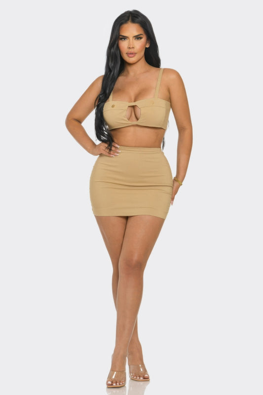 Model showcasing the Peek a Boo Skirt Set, featuring a fitted top and high-waisted skirt for a sleek look.