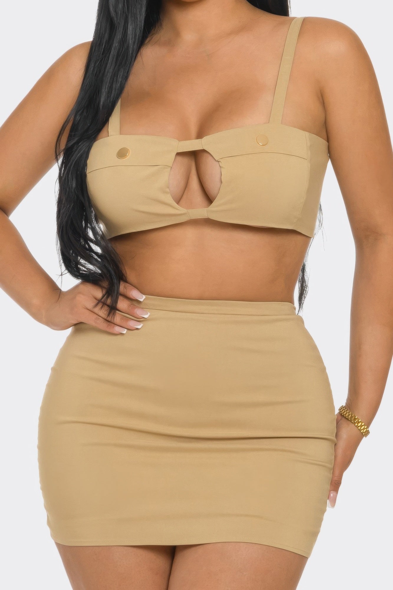 Model showcasing the Peek a Boo Skirt Set with a fitted top and high-waisted skirt in a sleek design.