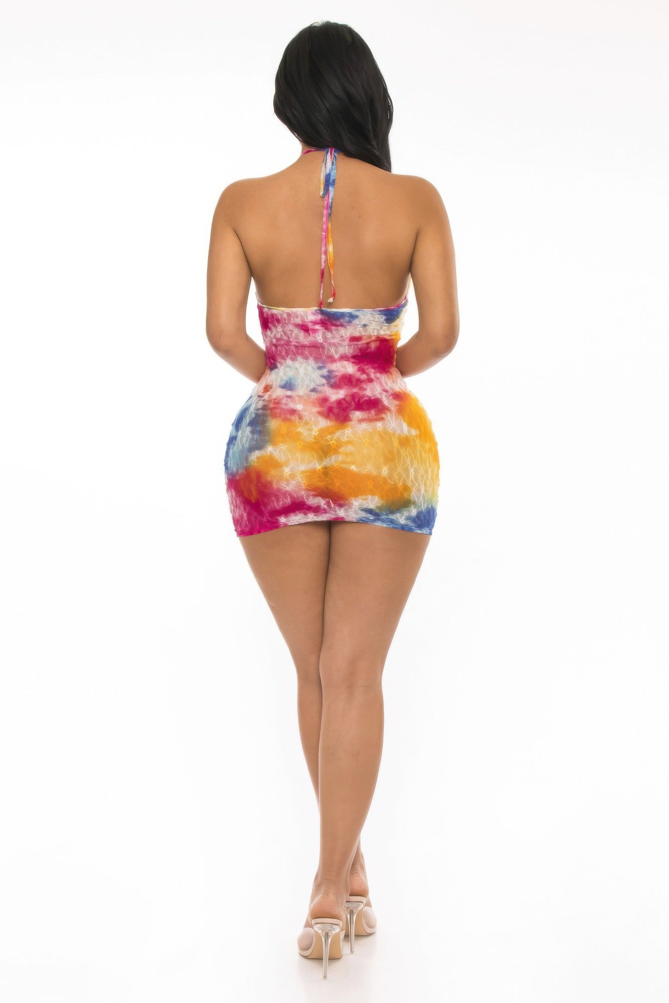 Model showcasing the back view of a multi color lace cover up dress with vibrant colors and a stylish halter design.