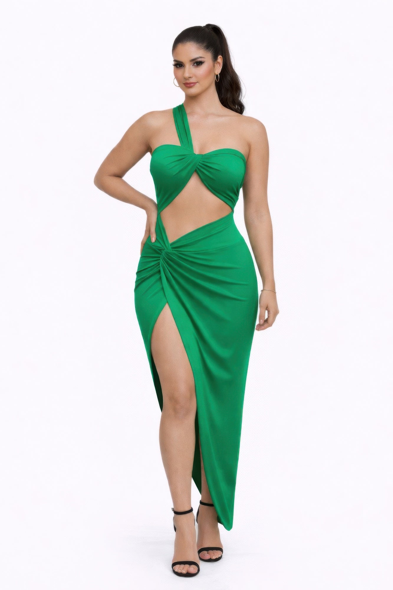 A model showcasing the bold statements dress featuring a green color, one-shoulder design, and stylish cutouts.